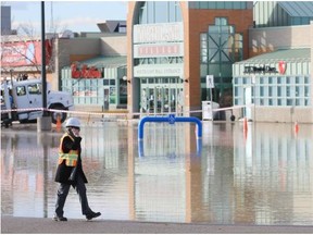 A large section of the south parking lot at Northland Village was flooded early Wednesday after a drill working in lot cut into a water line.