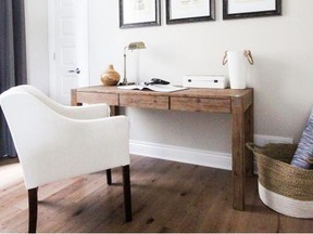 Leclair Decor A stylish dining chair replaces a typical desk chair to add a cosy feel to this rustic home office.