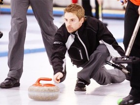 J.D. Lind watches a shot during the 2011 Southern Alberta men’s curling championship.