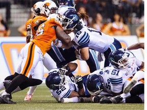 B.C. Lions linebacker Solomon Elimimian stops Toronto Argonauts quarterback Mitchell Gale during last week’s game at B.C. Place Stadium for one of his 98 tackles this season.