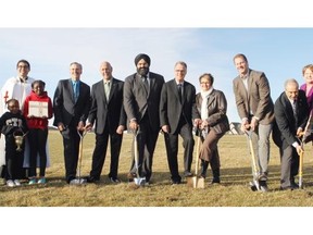 Lorraine Hjalte, Calgary Herald 
 CALGARY, ; October 24, 2014  --Father Cristino Bouvette, with two students along with Gary Strother, Chief Superintendent, Trustee Peter Teppler, Infrastructure Minister Manheet Bhullar, appointed Education Minister Gordon Dirks,  board chairwoman Linda Wellman and MLA Rick Fraser,  Trustees Serafino Scarpin, Mary Martin and Cheryl Low were at the blessing ceremony, along with students from south Cranston for new schools in Cranston kindergarten to Grade 6, as well as Auburn Bay (K-9), and New Brighton (K-6). These schools were announced by the province in 2013. The district typically holds sod turning and blessing ceremonies well ahead of construction, before the snow falls or the ground turns wet. Construction on a total of five schools is expected to begin in early spring 2015 with the schools opening in September 2016. (Lorraine Hjalte/Calgary Herald) For News story by . Trax # 00059881A