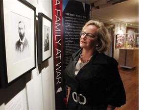 Lougheed House executive director Kirstin Evenden stands among the exhibit that shows Calgary’s hard journey through First World War. A Family at War: Calgary, the Lougheeds and the First World War shows how WWI affected the 40,000 people of Calgary, including the Lougheed family.