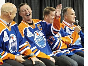 Mark Messier, left, Wayne Gretzky and Jari Kurri have a laugh as Paul Coffey tells stories during the 1984 Stanley Cup Reunion Introductory Media Availability in Edmonton on Wednesday. The team honoured some of the players prior to the game.