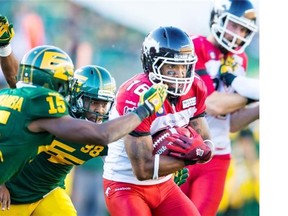 Marquay McDaniel of the Calgary Stampeders carries the ball against the Edmonton Eskimos last month. He has missed the club’s last five games with a broken hand but is on track to return for the regular-season finale Nov. 7 in Vancouver.