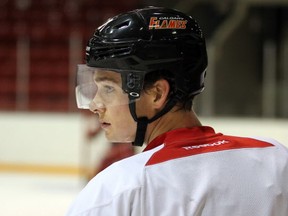 Mason Raymond waits his turn during a drill as the Calgary Flames took to the ice at the Stampede Corral on Monday, Oct. 6, 2014.