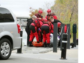 Members of the Calgary Fire Department aquatic team helped to recover a body from the banks of the Bow River on September 30, 2014.