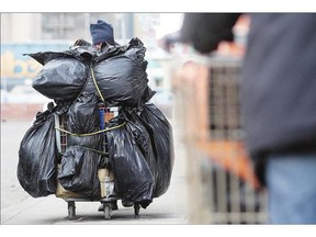 The annual Vital Signs quality-of-life checkup notes there are homeless people in Calgary, like Stuart, who is pictured pushing a shopping cart containing his belongings a cold November day last winter.