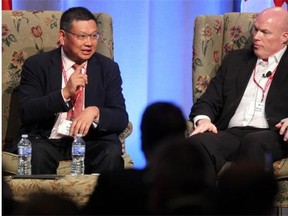 Cheung Kong Graduate School of Business professor Xiang Bing, left, spoke during the panel discussion with Nyhoff Investment Company Managing Partner Douglas Nyhoff, right, about China's Global Role during the Global Business Forum at the Banff Springs Hotel on September 18.