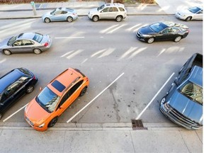 Vehicles on 9th Street S.W. drive past the angled parking spots between 7th and 8th avenues in Calgary, on Oct. 23, 2014.