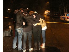 Young adults console one another after five university students were killed earlier this year in the worst mass murder in Calgary's history. The tragic event, which unfolded April 15 at a house party in Brentwood, was one of two mass murders in Calgary this year.