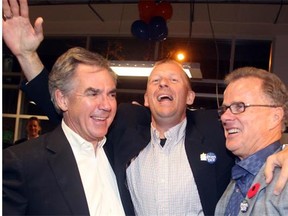 Victorious Tories, from left, Premier Jim Prentice, Mike Ellis and Gordon Dirks celebrate after winning their ridings, Calgary-Foothills, Calgary-Elbow and Calgary West in the byelections Monday night.