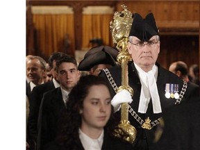 Sergeant-at-arms Kevin Vickers of the House of Commons leads MPs out of the House of Commons on Parliament Hill in Ottawa on Wednesday, March 3, 2010. Two sources told The Canadian Press that Vickers shot an assailant on Parliament Hill on Wednesday. THE CANADIAN PRESS/Pawel Dwulit
