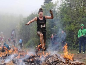 Obstacle course races are long and gruelling, often leaving people caked in mud, drenched and weary — new attitudes to extreme exercise suggest that you don’t need to punish yourself to attain a satisfying level of fitness. Epic Action Pictures/The Canadian Press