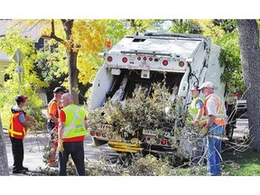 City crews clean up tree branches damaged in the September snowstorm. Reader says estimates of damaged trees may be too high.