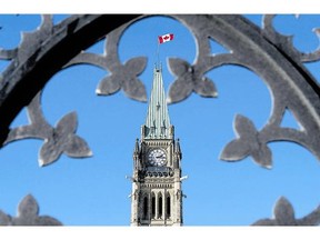 The Peace Tower is shown through the gates of Parliament Hill. After Wednesday's shootings in Ottawa, reader calls for tougher punishments for those engaged in terrorism.