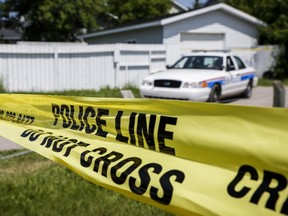Police tape cordons off the home where five-year-old Nathan O'Brien and his grandparents Alvin and Kathryn Liknes disappeared, in Calgary, Alta., Wednesday, July 2, 2014.