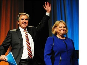 Jim Prentice and his wife Karen wave from the stage after the results of his 77% PC leadership victory are announced. Prentice must win a seat in the Legislature if he is to sit in on proceedings beginning Oct. 27.