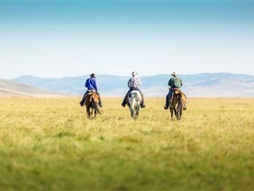 Riders at the Waldron ranch site. The Waldron Grazing Co-operative has signed the largest conservation easement in Canadian history, which preserves the land for large-scale cattle operations while protecting against development, subdivision, cultivation to domestic crops or drainage of wetlands.