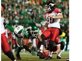 Saskatchewan Roughriders safety Tyron Brackenridge blocks a field goal attempt by Calgary Stampeders kicker Rene Paredes during the second quarter of CFL football action in Regina on Friday.