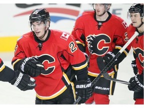 Sean Monahan of the Calgary Flames skates to the bench after scoring his second goal of the game against the Winnipeg Jets during the third period at the Saddledome in this file photo of preseason action October 2, 2014.