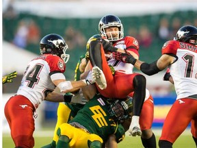 Simon Charbonneau-Campeau of the Calgary Stampeders comes down with the ball after the Edmonton Eskimos tried an onside kick late in Saturday night’s game. The receiver also caught the first touchdown of his CFL career.