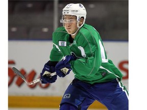 Injured Vancouver Canucks prospect and former Calgary Hitmen star Jake Virtanen takes off on a practice drill at the Young Stars Tournament in Penticton. Thursday, September 11, 2014.