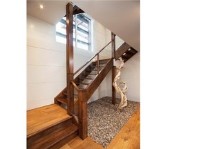 The staircase at the show home by Wolf Custom Homes in Watermark at Bearspaw. Courtesy, Wolf Custom Homes