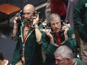 Traders work in the oil options pit at the New York Mercantile Exchange in this file photo. Oil markets have seen weeks of steady price declines.