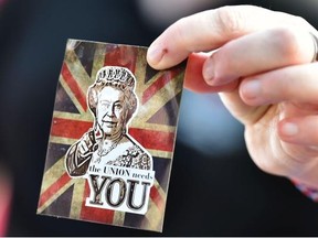 A No vote supporter holds a sticker depicting an image of the Queen. The arguments in favour of Scottish separation are unconvincing, says the Herald editorial board.