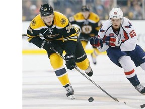 Washington Capitals winger Andre Burakovsky (65) battles for the puck Boston Bruins centre Carl Soderberg (34) in a game last weekend.