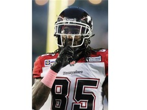 Joe West of the Calgary Stampeders gestures to Winnipeg Blue Bombers fans after his touchdown in the first half on Saturday. After the win, the Stampeders clinched top spot in the CFL West Division and kept alive a possibility they could be the first team since the 1989 Edmonton Eskimos to win 16 games in a regular season.