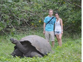 My wife and I with a giant tortoise in the Galapagos.