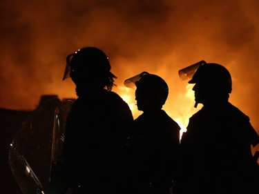 Buildings burn during a protest on November 24, 2014 in Ferguson, Missouri. A St. Louis County grand jury has decided to not indict Ferguson police Officer Darren Wilson in the shooting of Michael Brown that sparked riots in Ferguson, Missouri in August.