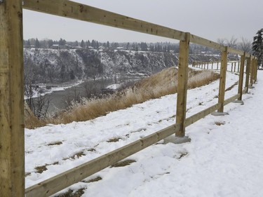 A fence is being built along an escarpment in a park near Britannia Drive S.W.