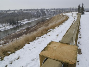 A fence is being built along an escarpment in a park near Britannia Drive S.W.