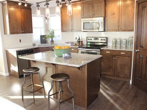 The kitchen in the Kennedy show home by Excel Homes in Walden. Andrea Cox, For the Calgary Herald