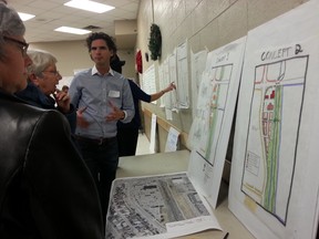 Planner Jaydean Boldt explains design concepts to Thorncliffe Greenview residents for the Drop-In Centre's proposed Centre 4800 affordable housing project on Edmonton Trail N.E. The community association hosted an open house November 21 to discuss alternate visions for the former Quality Inn.