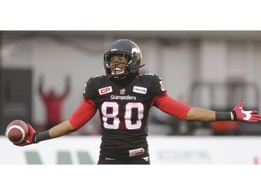 Sederrik Cunningham of the Calgary Stampeders celebrates his touchdown agains the Edmonton Eskimos during the 2014 CFL West Final at McMahon Stadium on November 23, 2014.