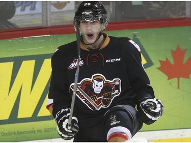 Calgary Hitmen Connor Rankin celebrates his goalie against the Swift Current Broncos during Western Hockey League action at the Scotiabank Saddledome in Calgary, on November 28, 2014.
