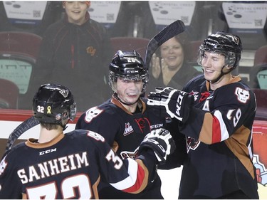 Calgary Hitmen Connor Rankin celebrates a goal with teammates during Western Hockey League action against the Swift Current Broncos at the Scotiabank Saddledome in Calgary, on November 28, 2014.