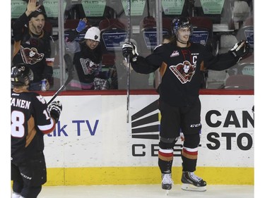 Calgary Hitmen Kenton Helgesen celebrates his goal against the Swift Current Broncos at the Scotiabank Saddledome in Calgary, on November 28, 2014.