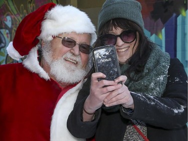 Santa was spotted by Nikki Byrd in Kensington in Calgary, on November 29, 2014, and kindly stopped for a little celebrity selfie action.