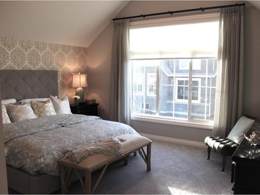 The master bedroom in the Cascade show home by Calbridge Homes in Mahogany offers a retreat with character.