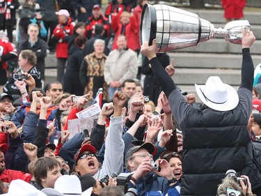 Fans react as Stampeder Randy Chevrier holds up the Grey Cup at the Olympic Plaza during a rally to celebrate the Stamps' 2008 Grey Cup win.