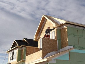 Justin Bonsteel who owns Bonsteel Construction, works on a house at Auburn Bay in Calgary, Alberta on January 4, 2013.