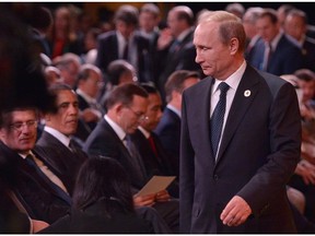Russian President Vladimir Putin arrives as Prime Minister Stephen Harper and U.S. President Barack Obama look on during the G20 Summit.