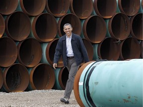 This March 22, 2012 file photo shows President Barack Obama arriving at the TransCanada Stillwater Pipe Yard in Cushing, Okla.