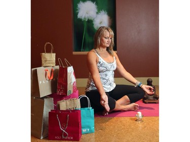 Helen Vanderburg relaxes with yoga at Heaven's Fitness after hectic Christmas shopping, in Calgary on November 18, 2014.