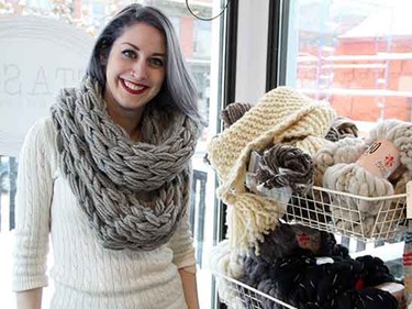 A grey cowl-neck scarf is a stylish way to keep warm indoors and out.