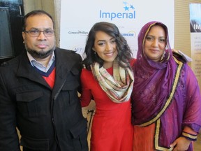 Cal1129 Philanthropy 3 Nazifa Rahman was presented with the Outstanding Youth Philanthropist Award at the 18th annual National Philanthropy Day Luncheon held Nov 14 at the BMO Centre. Pictured, with Nazifa are her proud parents Atiar and Syeda Rahman.